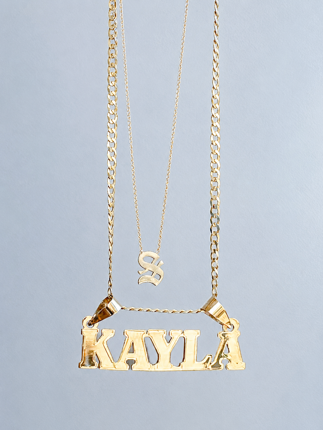 name neckalce in gold.png