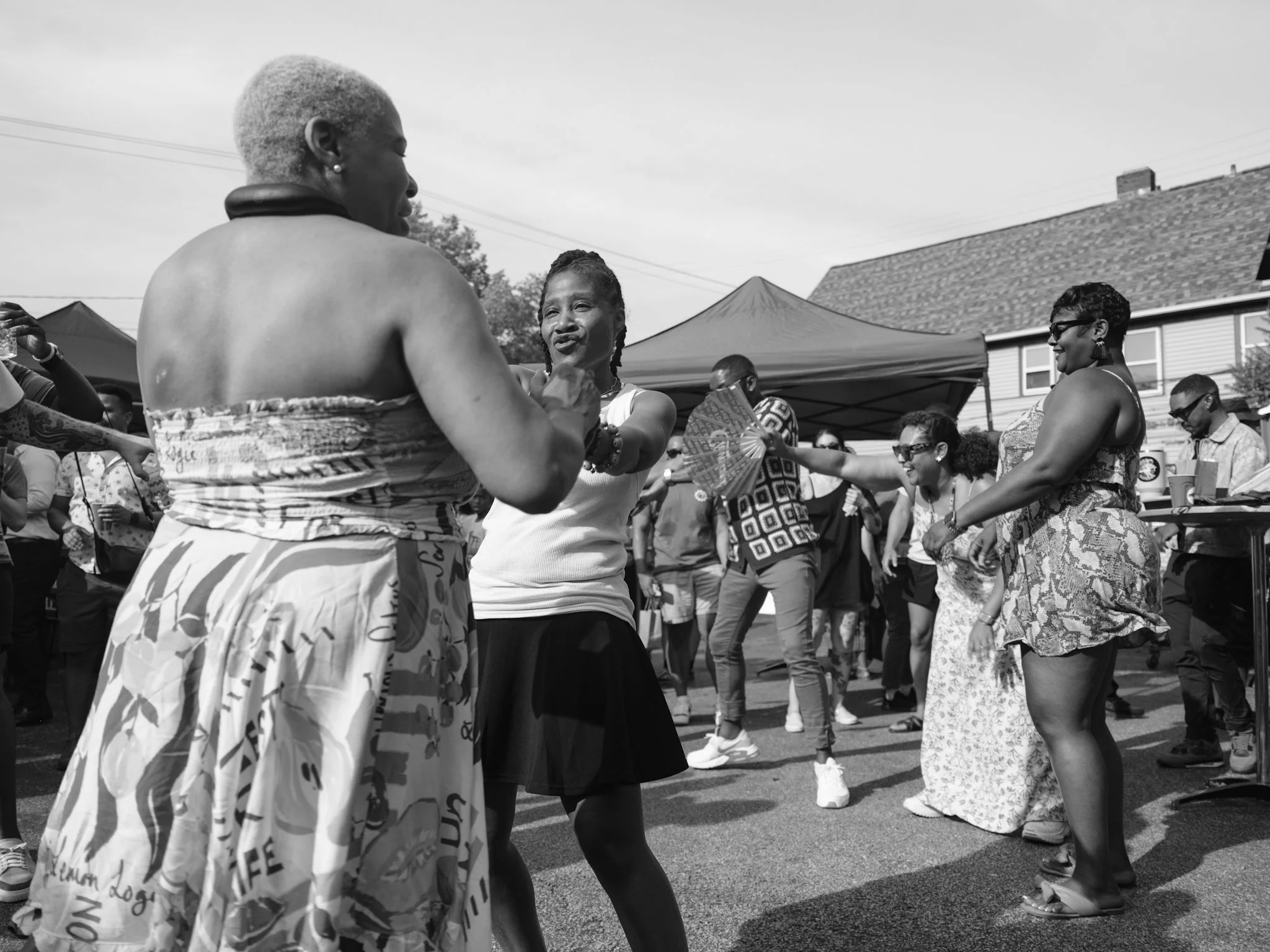 People dancing outdoors at the Larchmere Porch Fest.