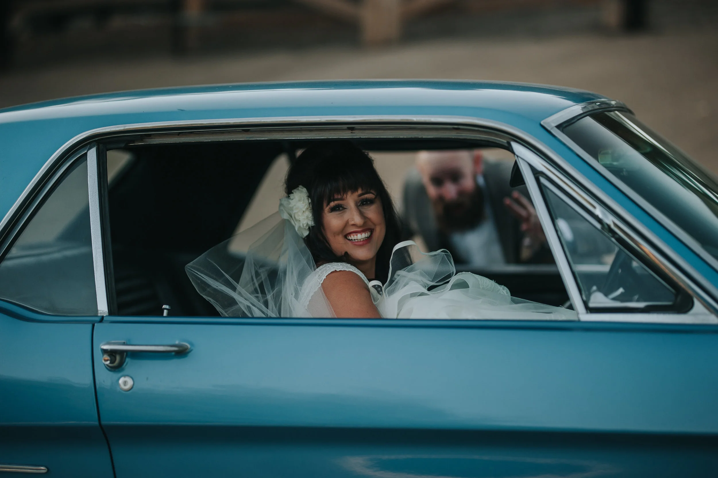 Bride wearing Zac Posen, riding in 1966 vintage Mustang, in the Temecula Valley.