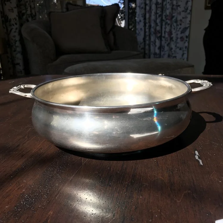 Silver-plated Bowl with Handles Vintage silver plated serving bowl with two handles on the side. Plain with no detailing. 11" round x 3" tall.