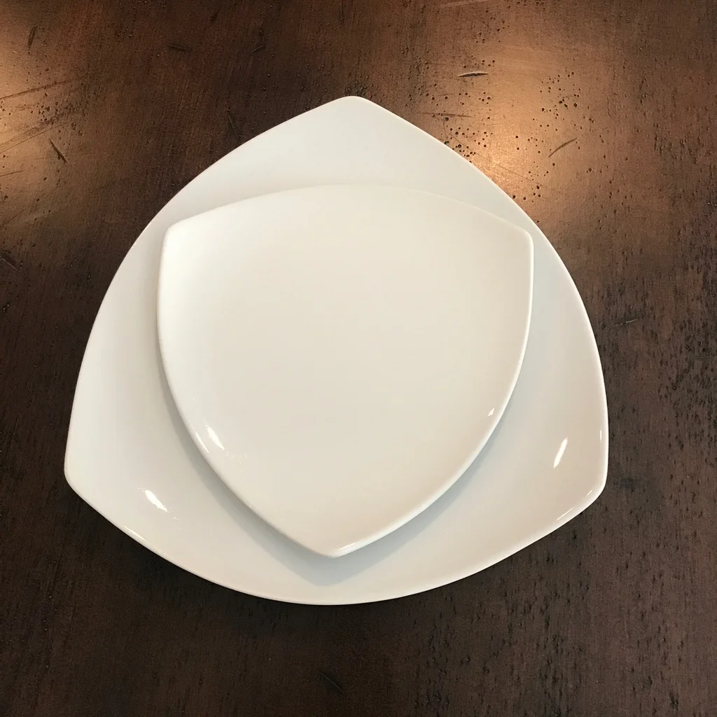 White china triangle contemporary dinner plate with salad plate. Perfect for a modern table flair. Rentals in The Temecula Valley.