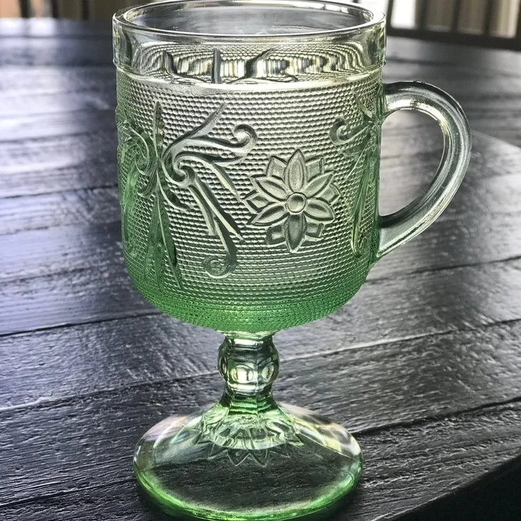 Lime green Anchor Hocking tall cut glass cup on a pedestal with handle. Very mid century modern.