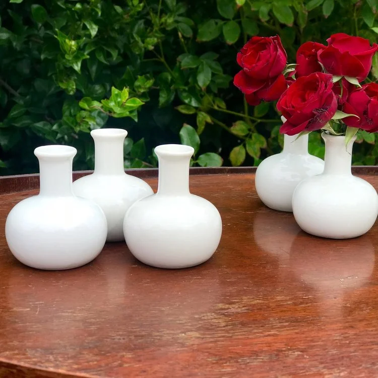 Mini White Bud Vases 3” tall. Great addition to a table. Perfect in groups.