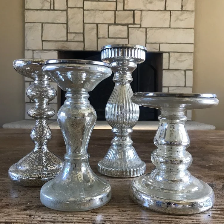 Glass mercury glass candlesticks.