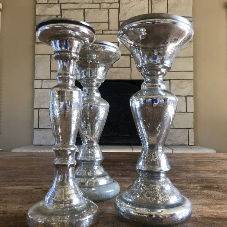 Medium mercury glass candlesticks.