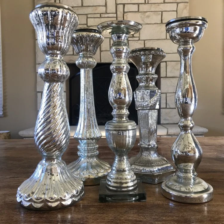 Large mercury glass candlesticks.