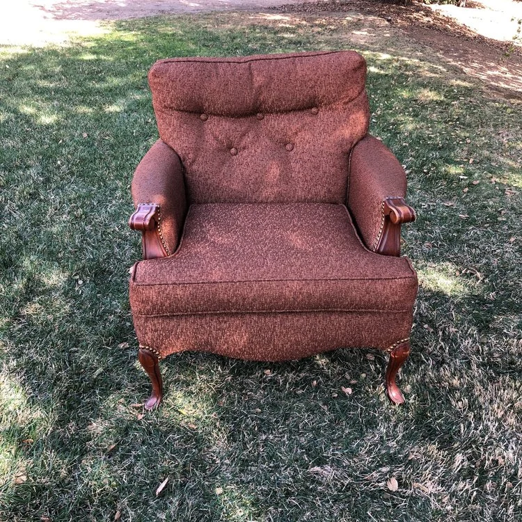Jasper Mid-century Modern brown nubby fabric with a tufted back and nailhead trim. 32" wide x 31" high x 38" deep. Seat is at 16" high