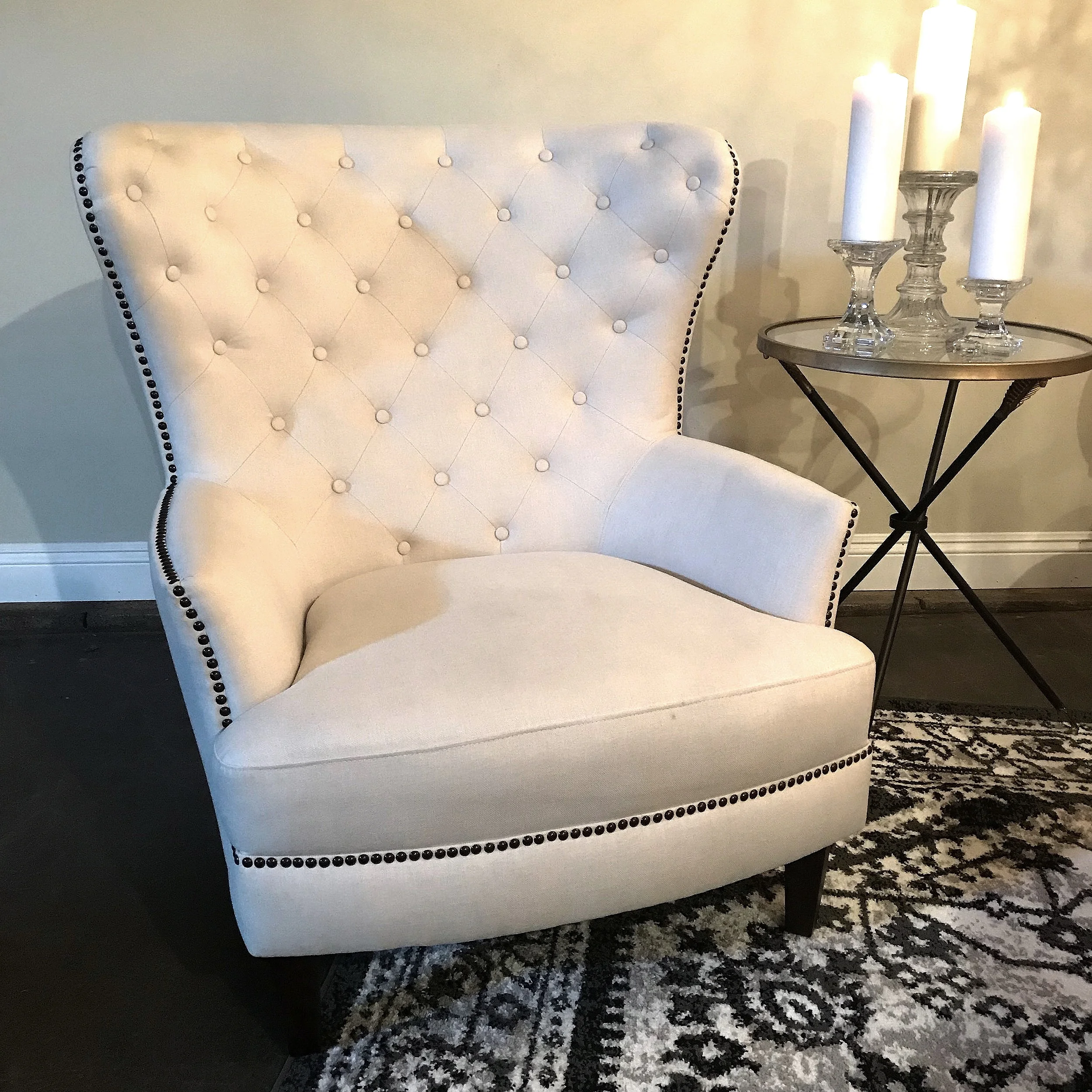 Logan Cream linen, tufted wing back chair with nail head trim. Great for a lounge area.