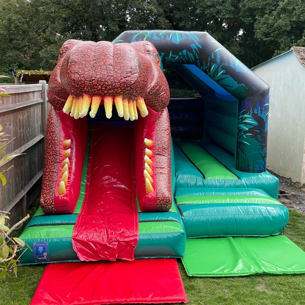 sci-fi dinosaur slide combi bouncy castle Crowborough