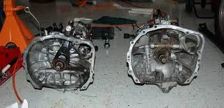 On the Left a Push style transmission (Clutch fork pushes toward bellhousing) On the Right a Pull style transmission (Clutch fork pulls toward the tail end of the transmission)