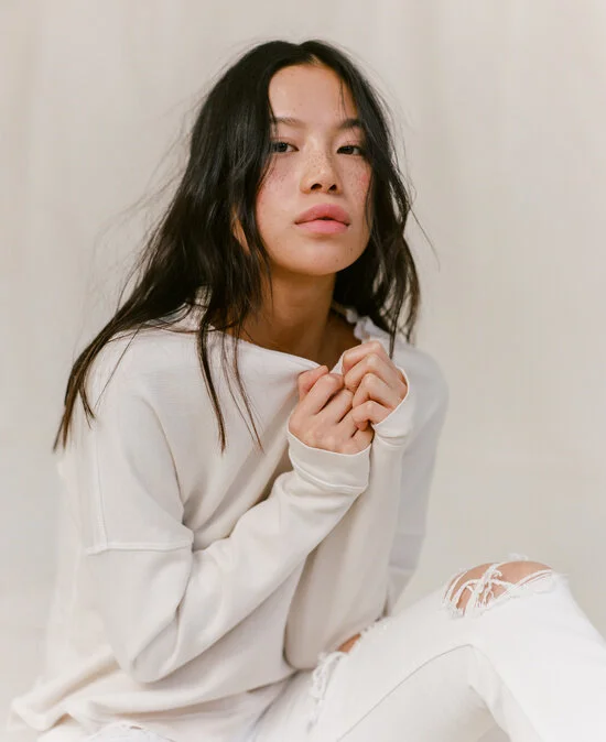 Sweater and Torn Jeans