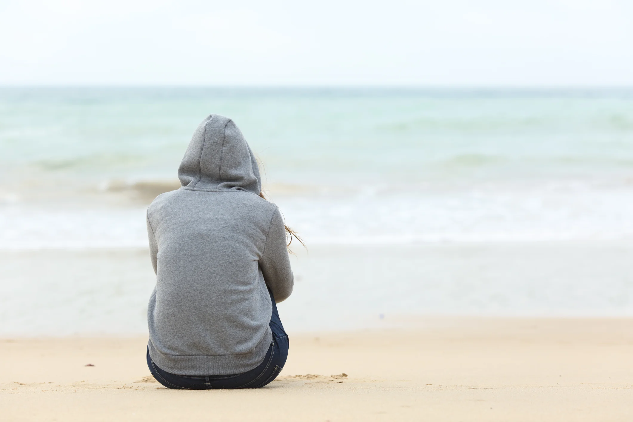 Teenager-girl-thinking-watching-the-sea-621383470_2125x1416.jpeg