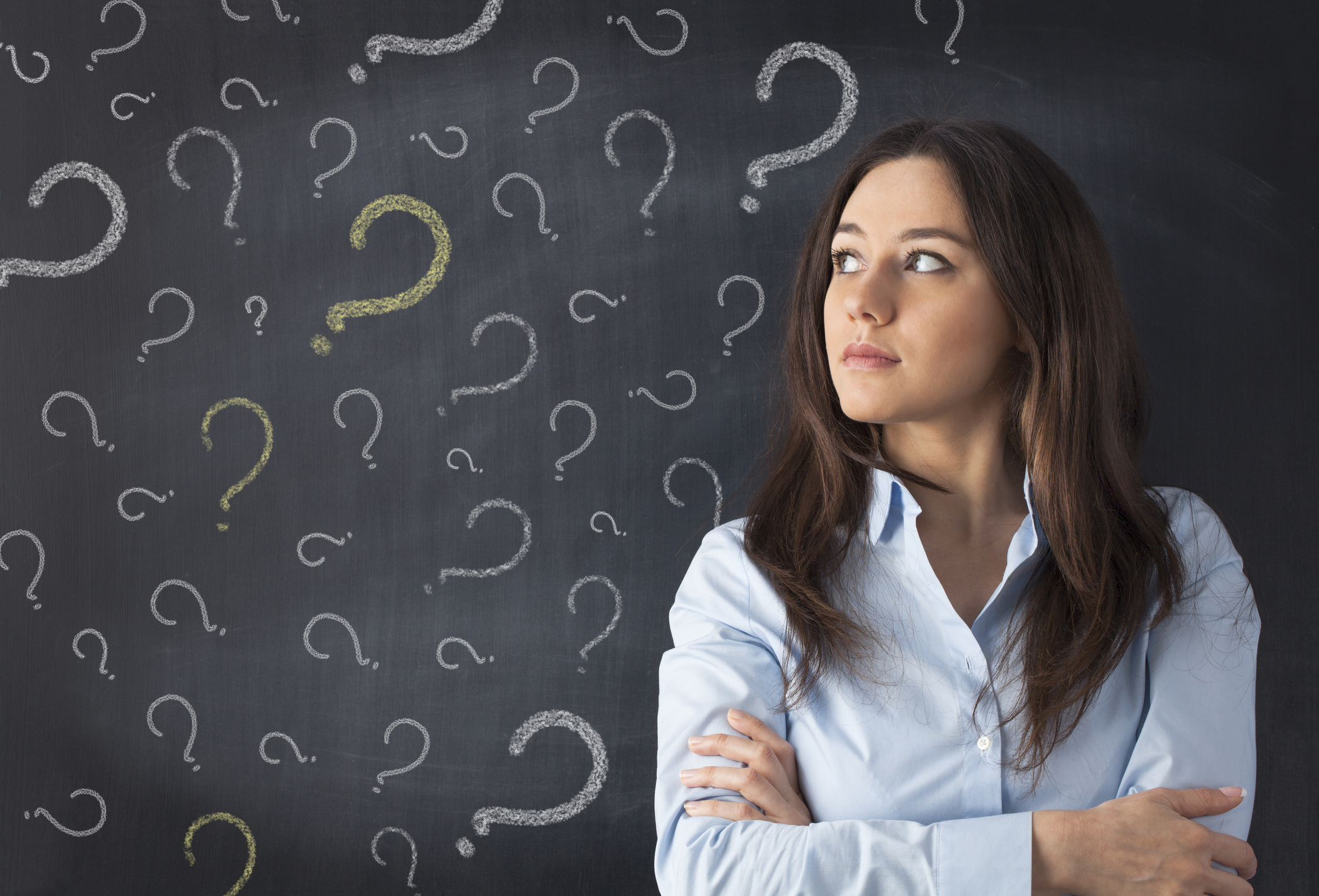 Young-woman-thinking-with-blackboard-487756038_2104x1429.jpeg
