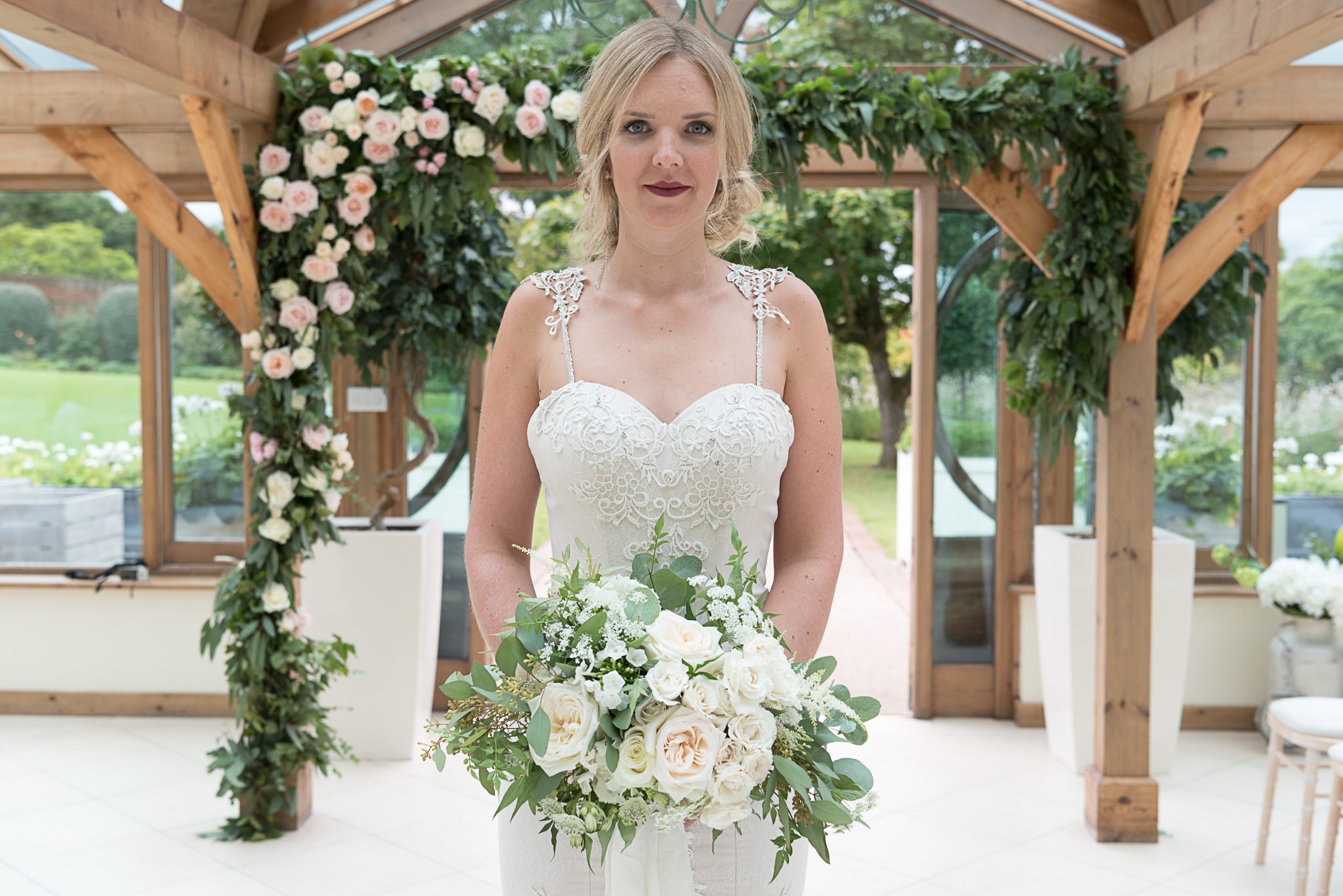 Modern English Rose Bride, Flowers by Petal and Wild, bride in front of floral arch 1 image by Victoria Murray Photography_mini.jpg