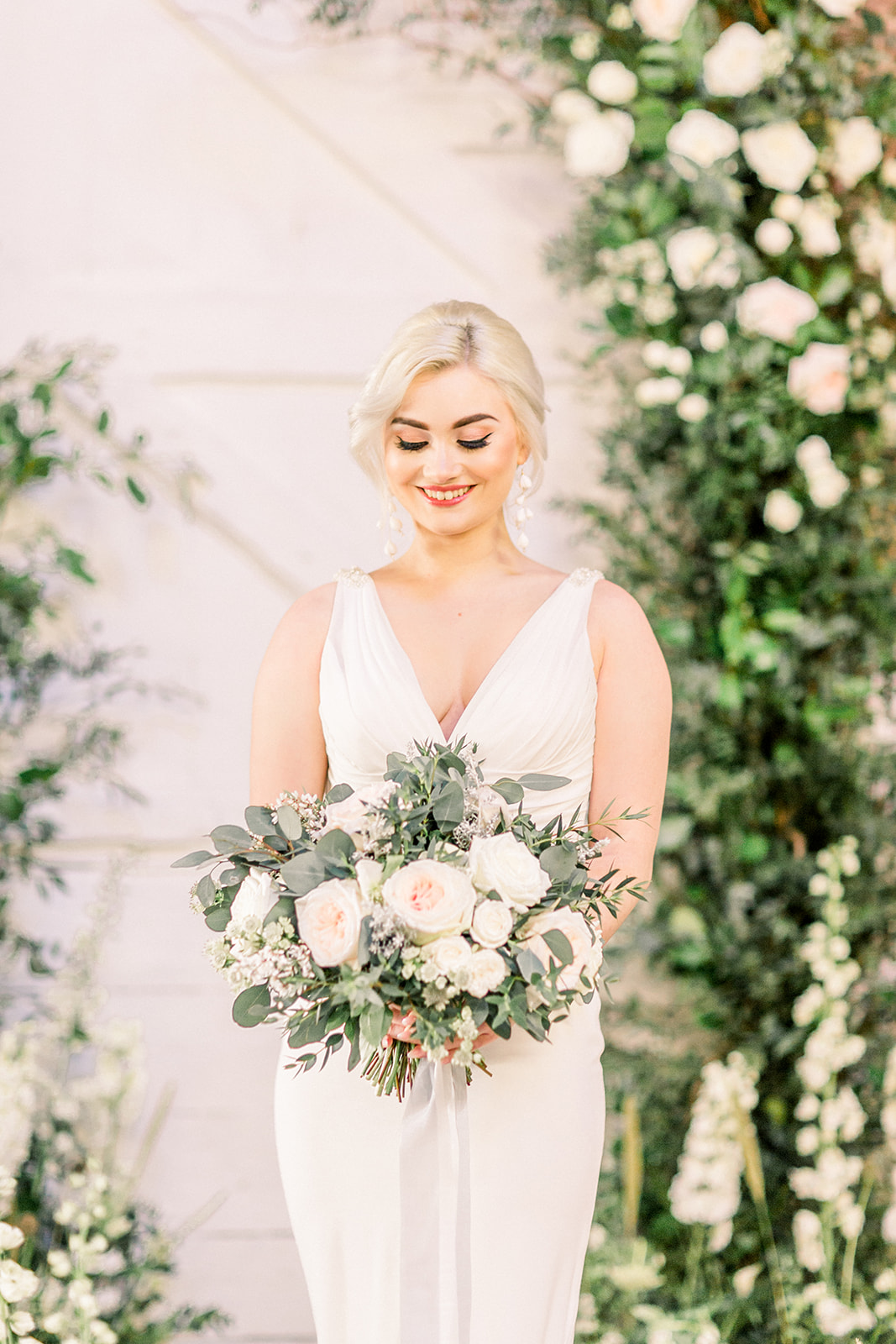 Floral arch and bridal bouquet by Petal and Wild at The Railway Barn.jpg