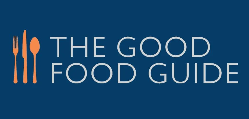Logo for The Good Food Guide featuring a fork, knife, and spoon in orange on a blue background with the text 'The Good Food Guide'.