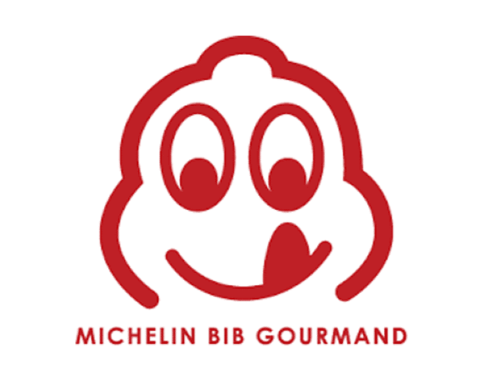 Logo of Michelin Bib Gourmand featuring a cartoonish smiling face with tongue sticking out, outlined in red, with the text "Michelin Bib Gourmand" below.