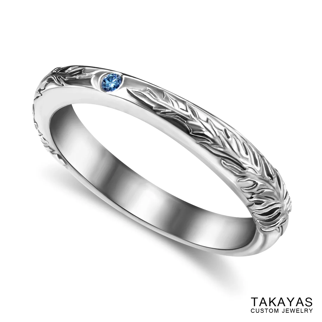 photograph of finished ring with hand-engraved details