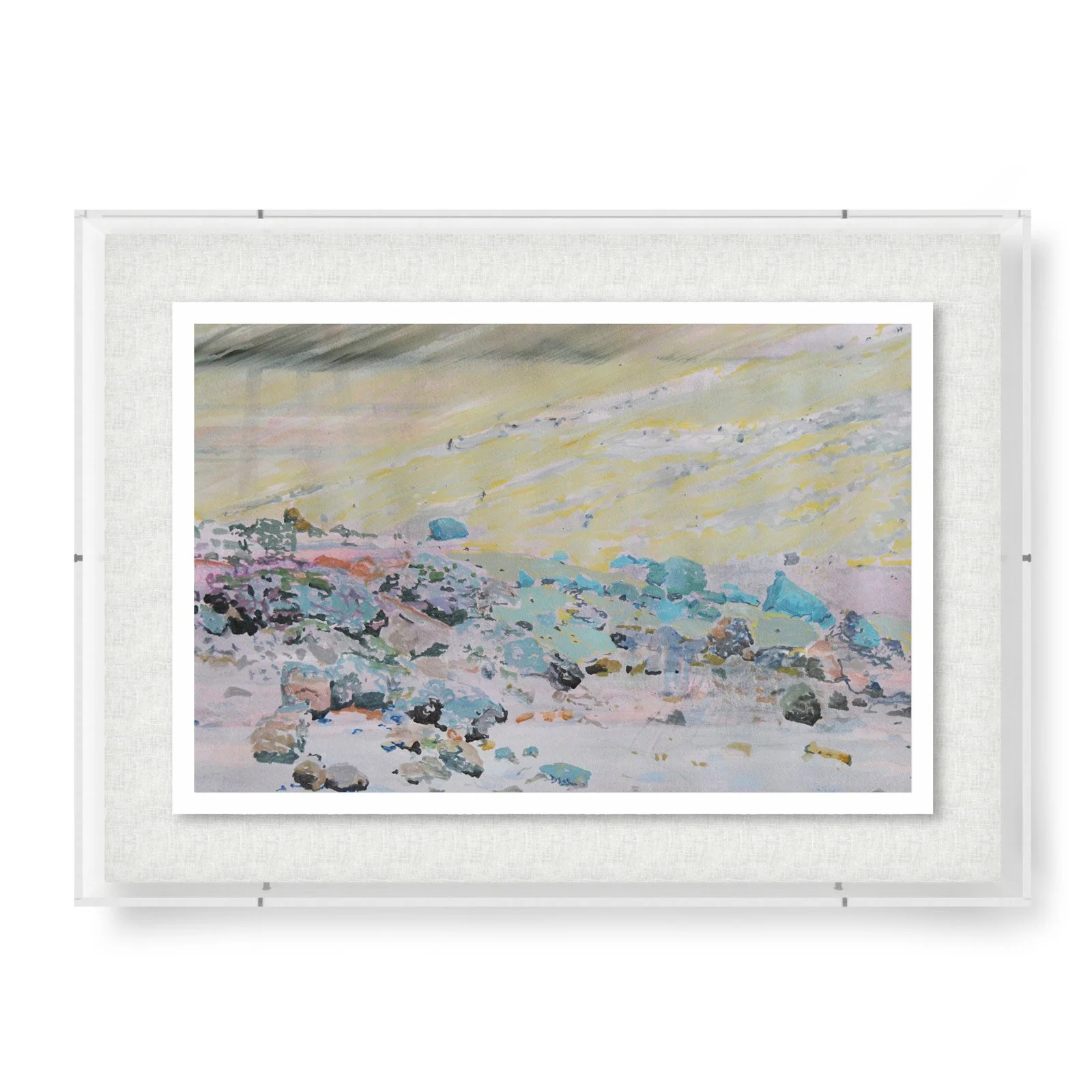 Modern acrylic-framed art object featuring an abstract pastel landscape with soft pink, blue, yellow, and gray tones suggesting hills and sky.