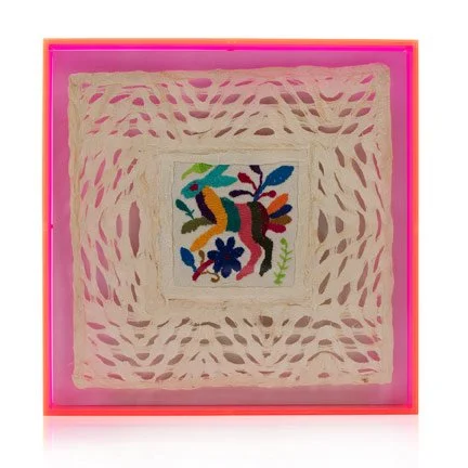 Colorful embroidered rabbit surrounded by floral motifs, framed in bright pink with lace-like cut-out border