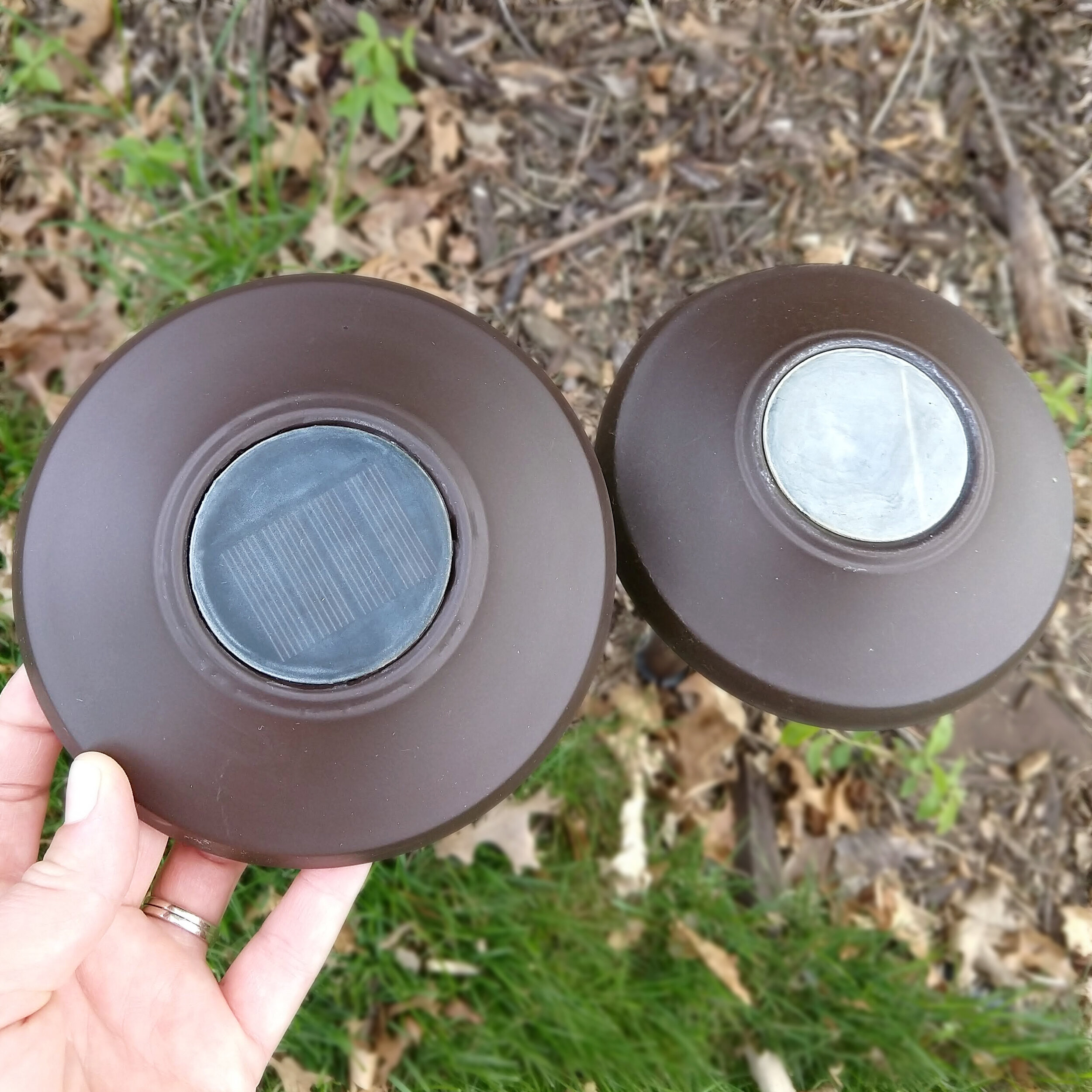 Pictured Above: Solar light on the right is before doing any of the steps mentioned above. The light on the left is after some progress of spraying with water and sanding!
