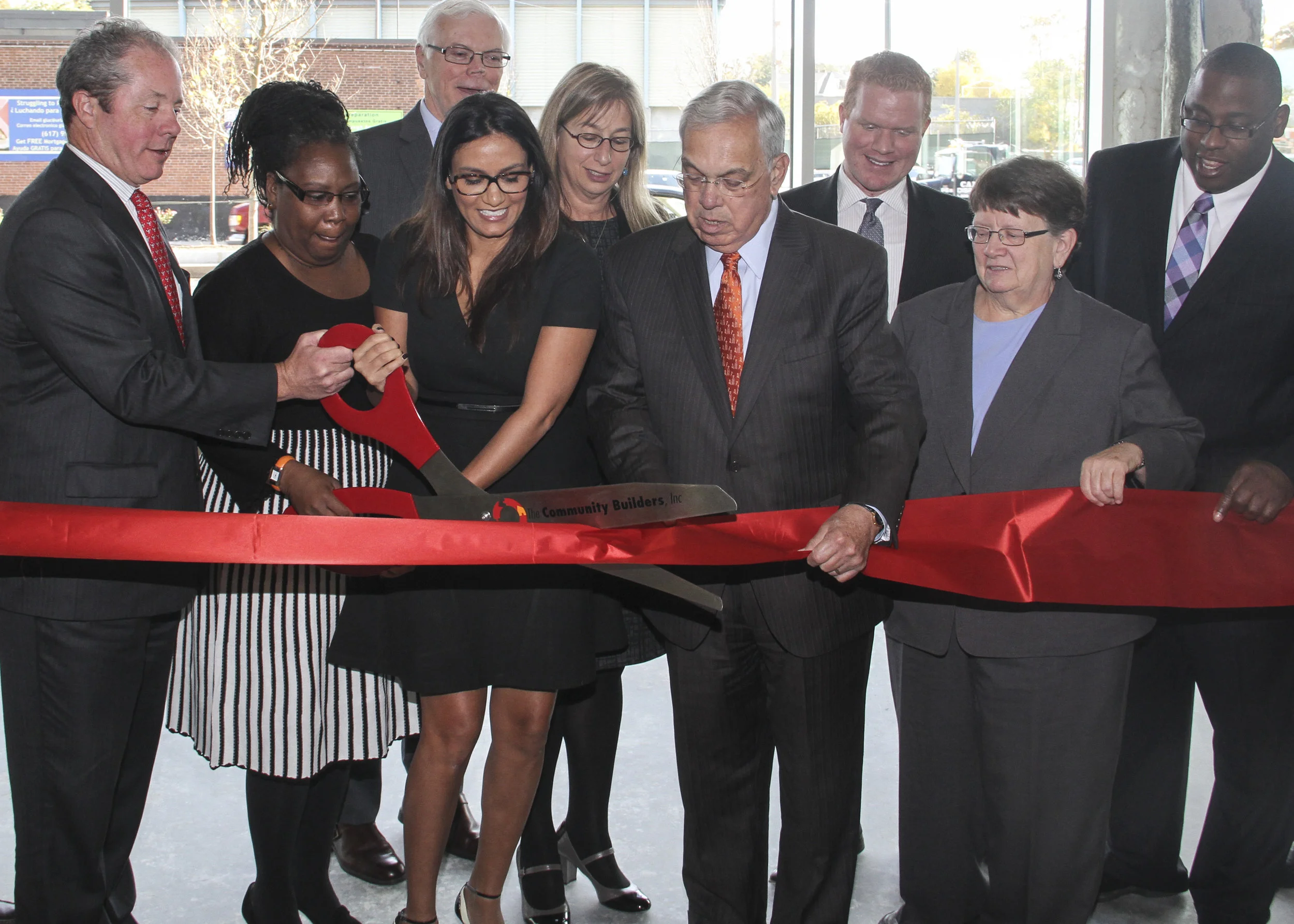 Boston Mayor Thomas Menino, center, takes part in the ribbon cutting with, from left, Bart Mitchell of the Community Builders, Chrystal Kornegay of Urban Edge, HIT's Tom O'Malley, 225 Centre resident Ana Durate, HUD's Barbara Fields, Boston City Councilor Matt O'Malley, State Rep. Elizabeth Malia, and Boston City Councilor Tito Jackson