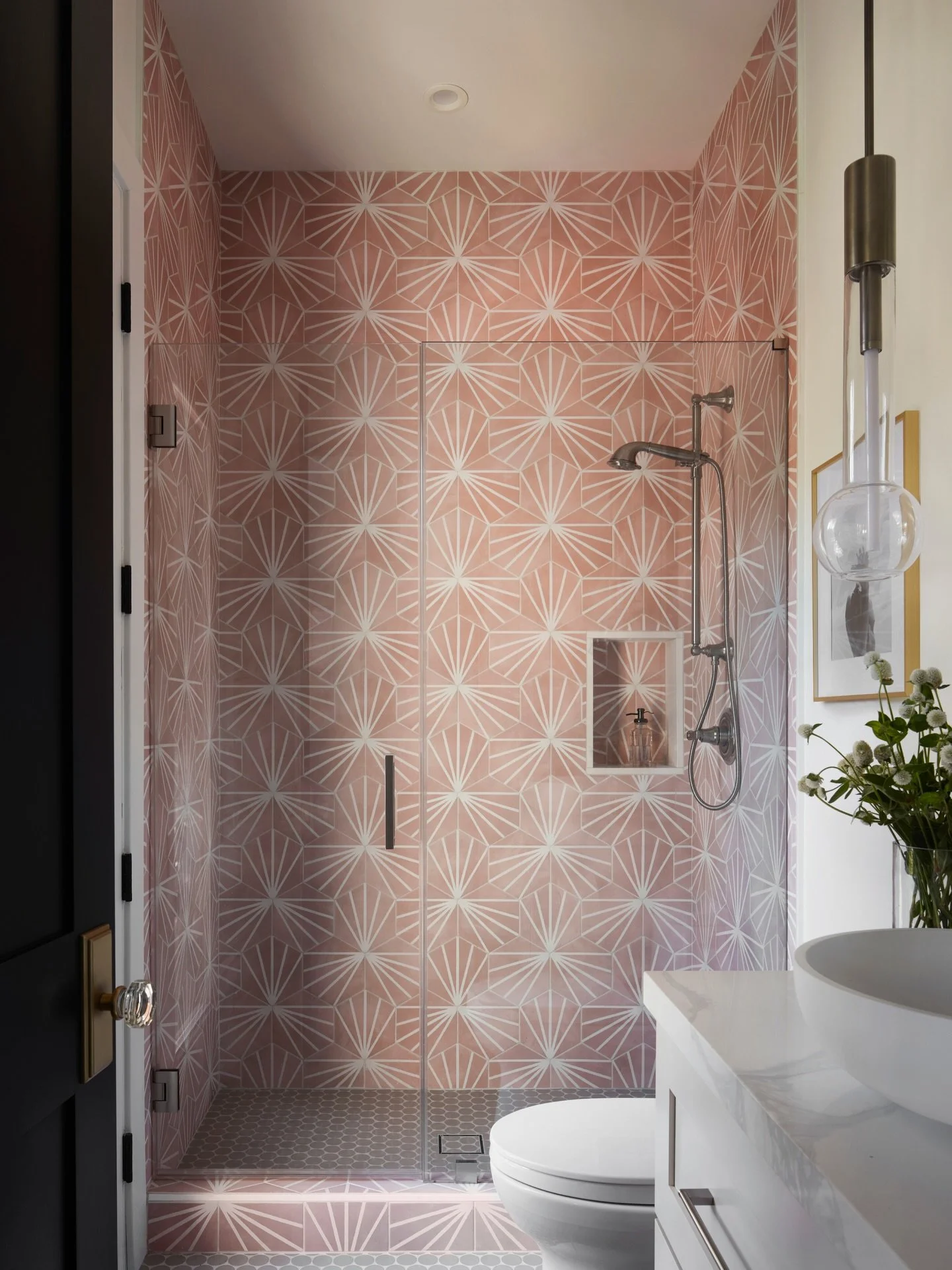 A guest bathroom designed to surprise &mdash; and endure.

Pattern, color, and geometry come together here to create a space that feels confident without being overwhelming. The tile was selected to bring rhythm and movement, while clean-lined fixtur