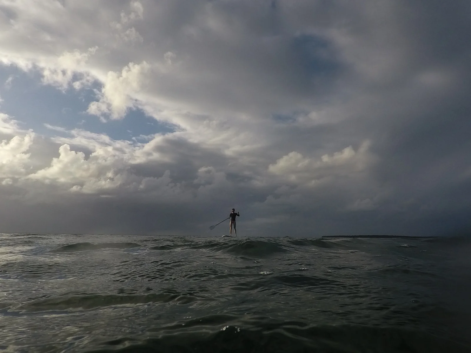 Stephanie took out the SUP and caught some amazing late afternoon light against distant stormy skies.