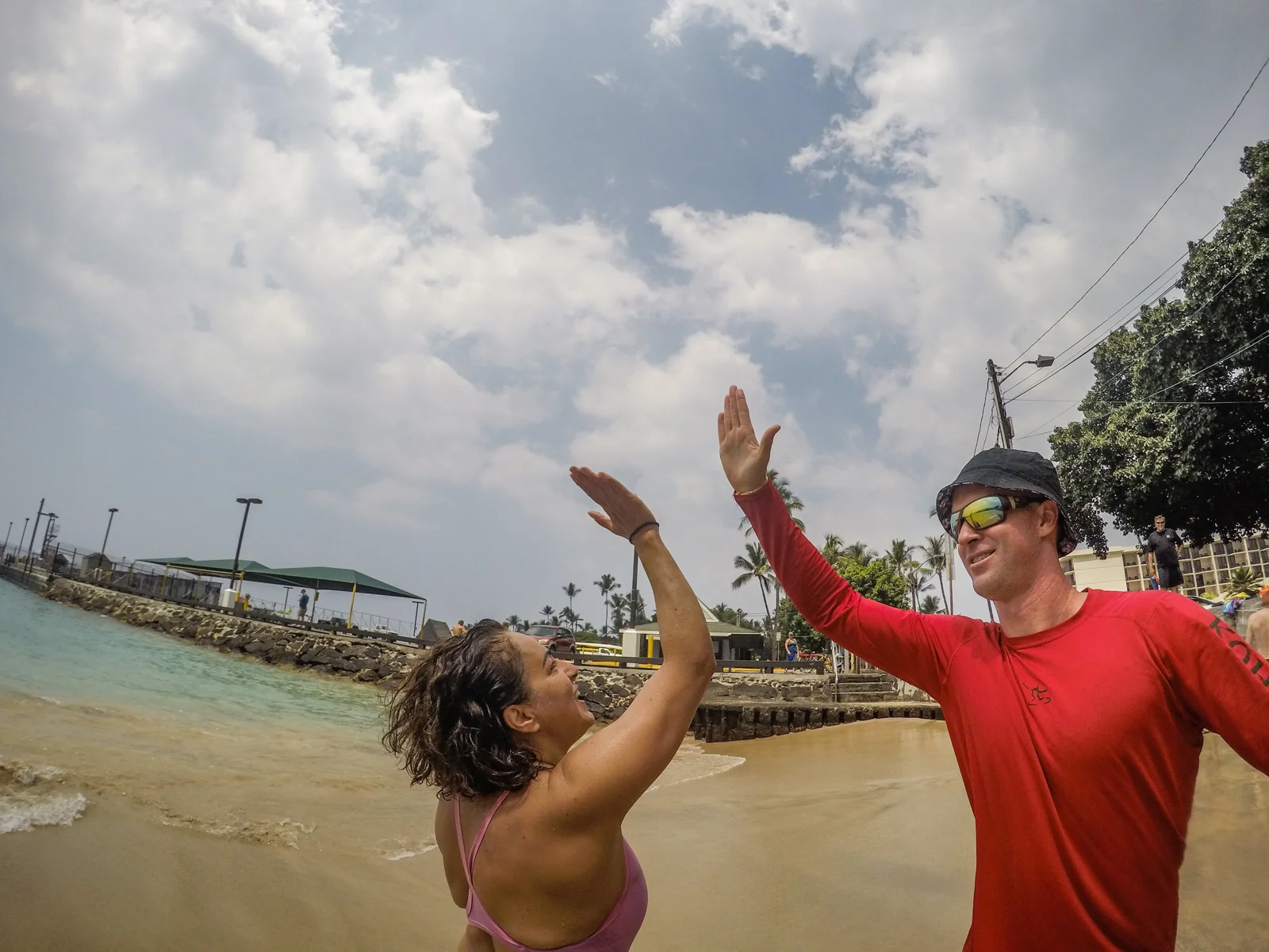 Yafa and McGooks high five at her completion of the iconic swim.
