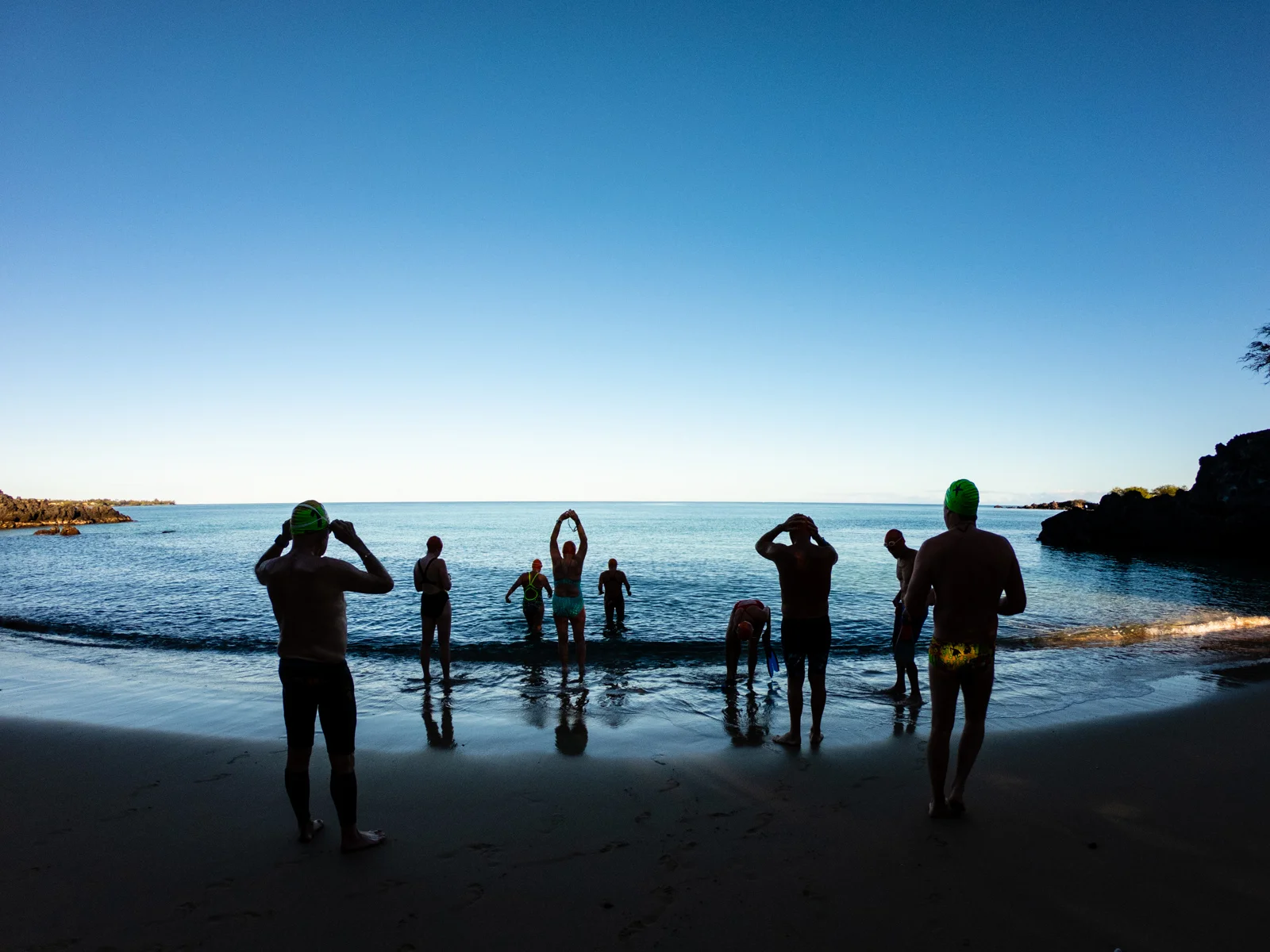 Saturday’s early morning swim, our final splash, treated us to flat, calm waters at our home beach.
