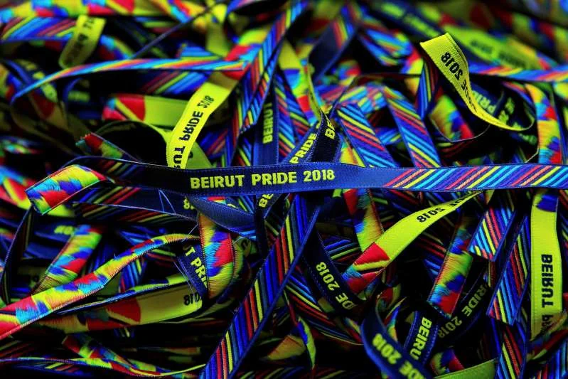 In this picture taken Saturday, May 12, 2018, bracelets decorated with the rainbow colors are displayed at a restaurant during the launch event of Beirut Pride week in Beirut, Lebanon. The organizer of Lebanon's struggling gay pride week has been briefly detained days into the celebrations and the rest of the festival's events cancelled. (AP Photo/Hassan Ammar)