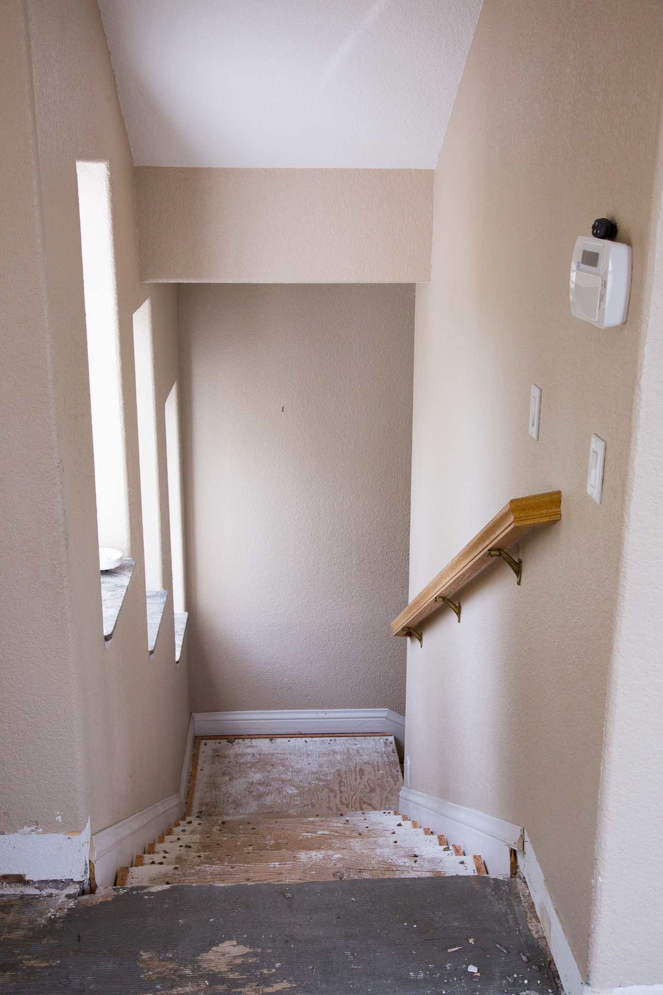STAIRS IMMEDIATELY OFF OF ENTRY, LEADING TO GROUND FLOOR