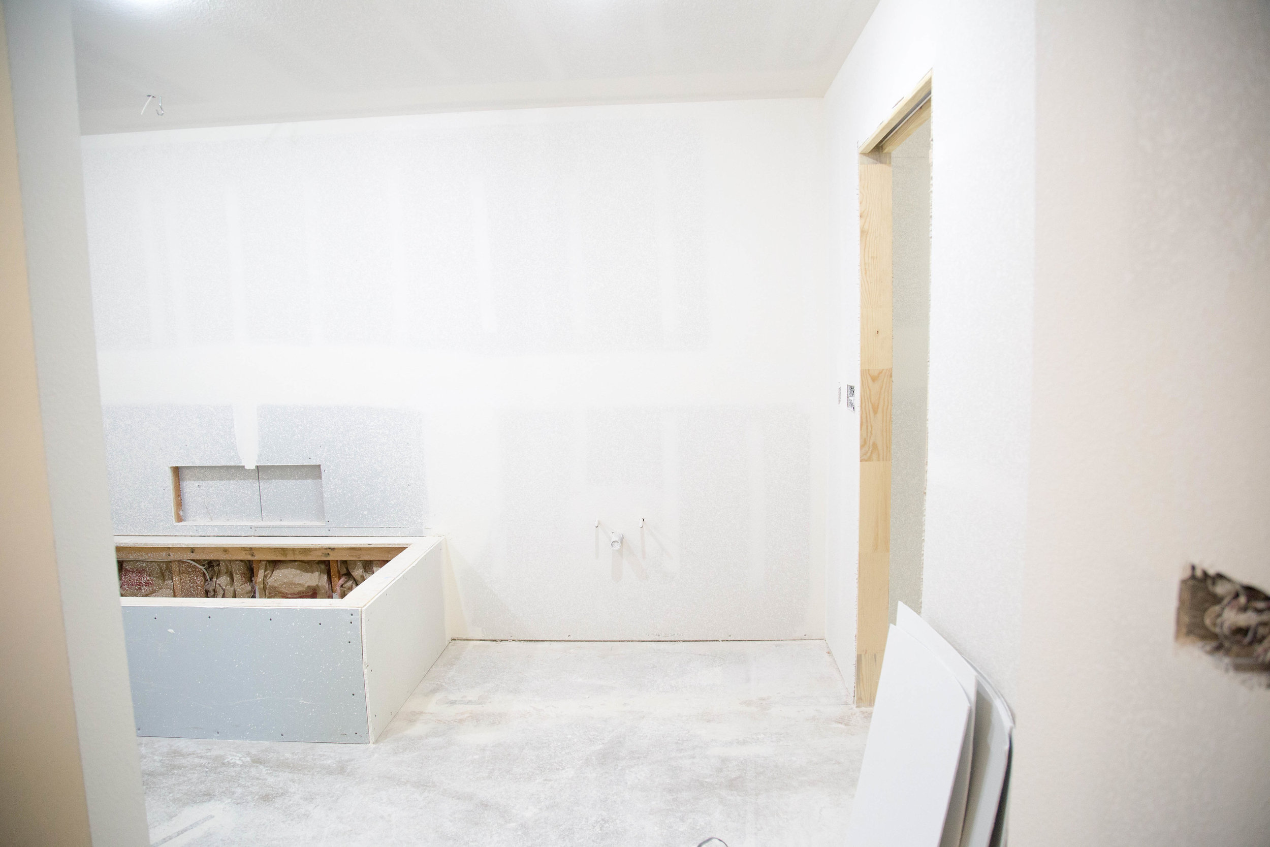 Looking from the bathroom entry towards the tub and shower.