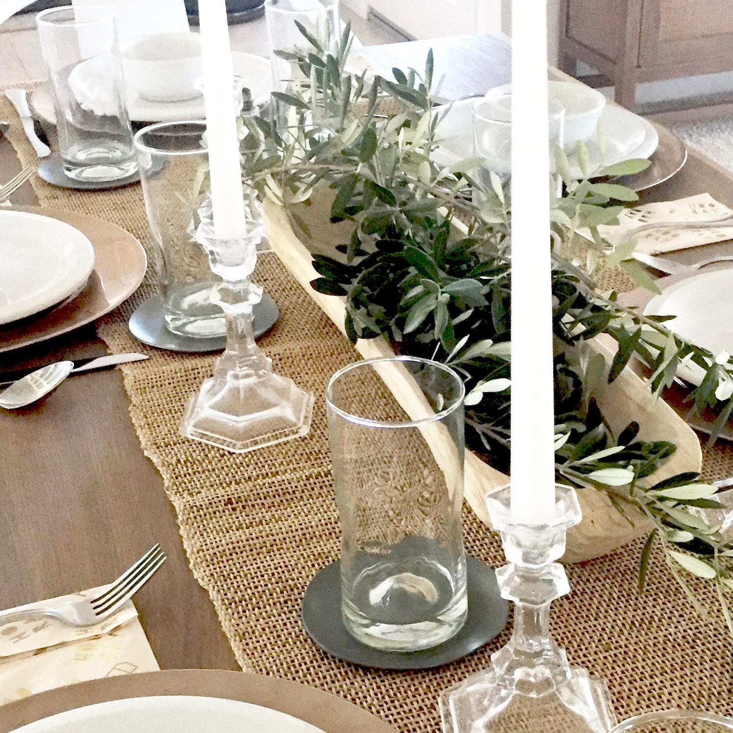Olive Branches placed in a Hand-Carved Bowl - They will stay green and last for days , even without water.
