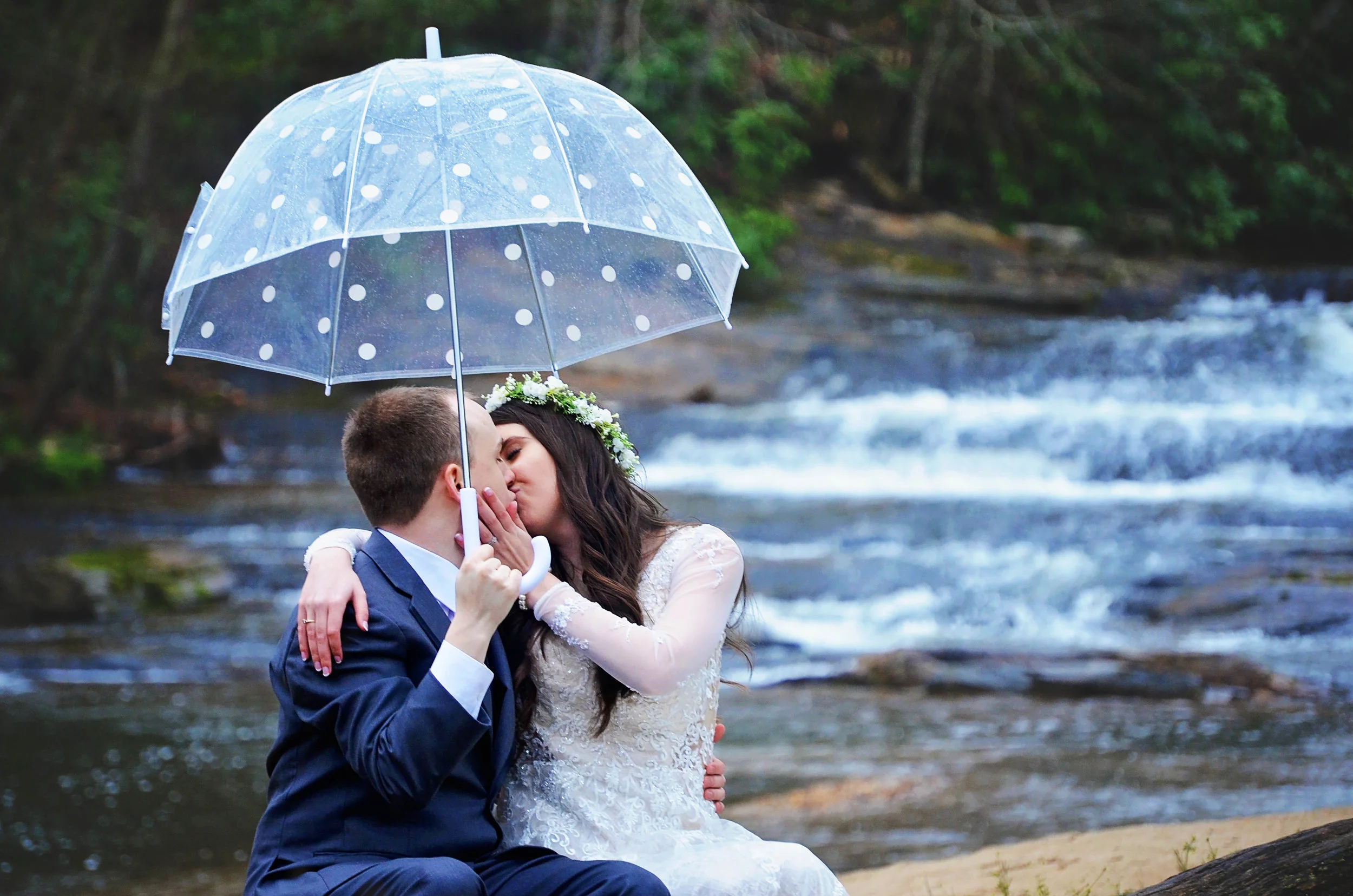 Amanda and Jarel.UmbrellabytheRiver.jpg