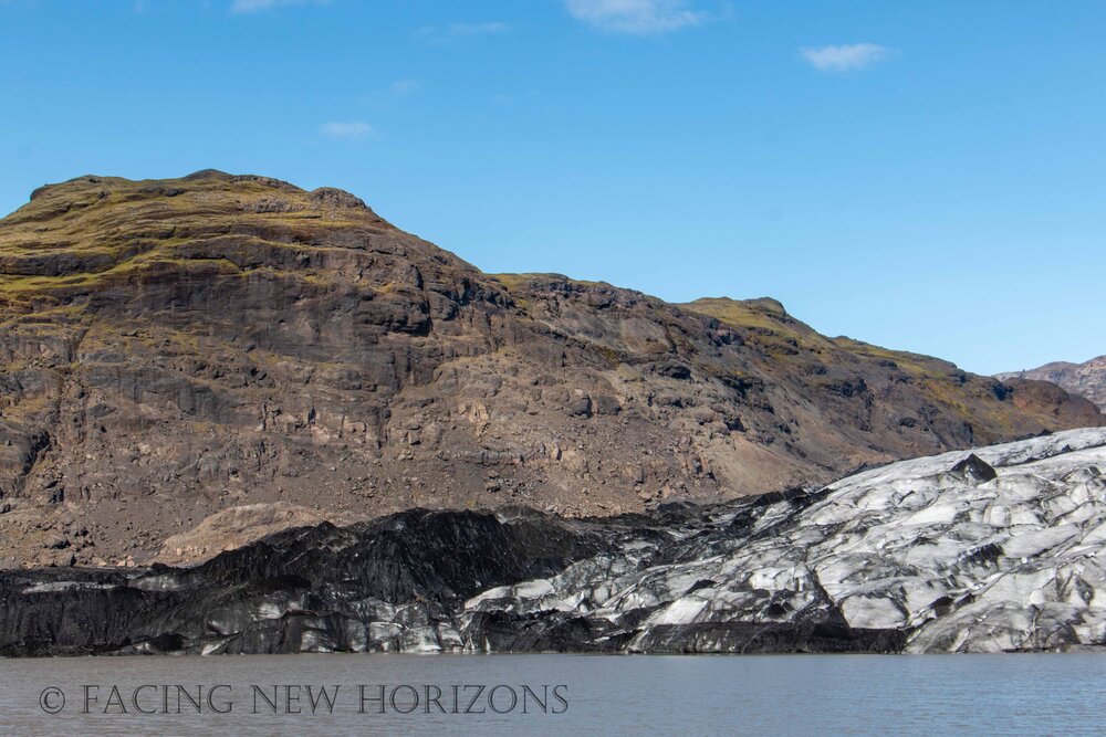  The glacial ice flows down between the mountains 