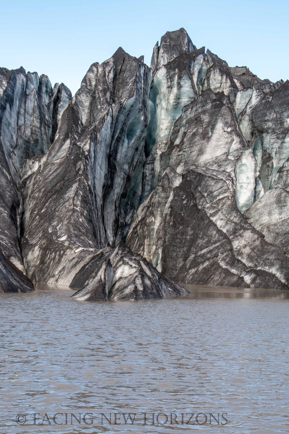  Sharp ice features tower over the water like mountains of their own 