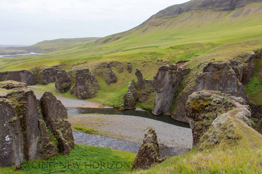  At the start of Fjaðrárgljúfur Canyon, where the hills rise to the cliffs 