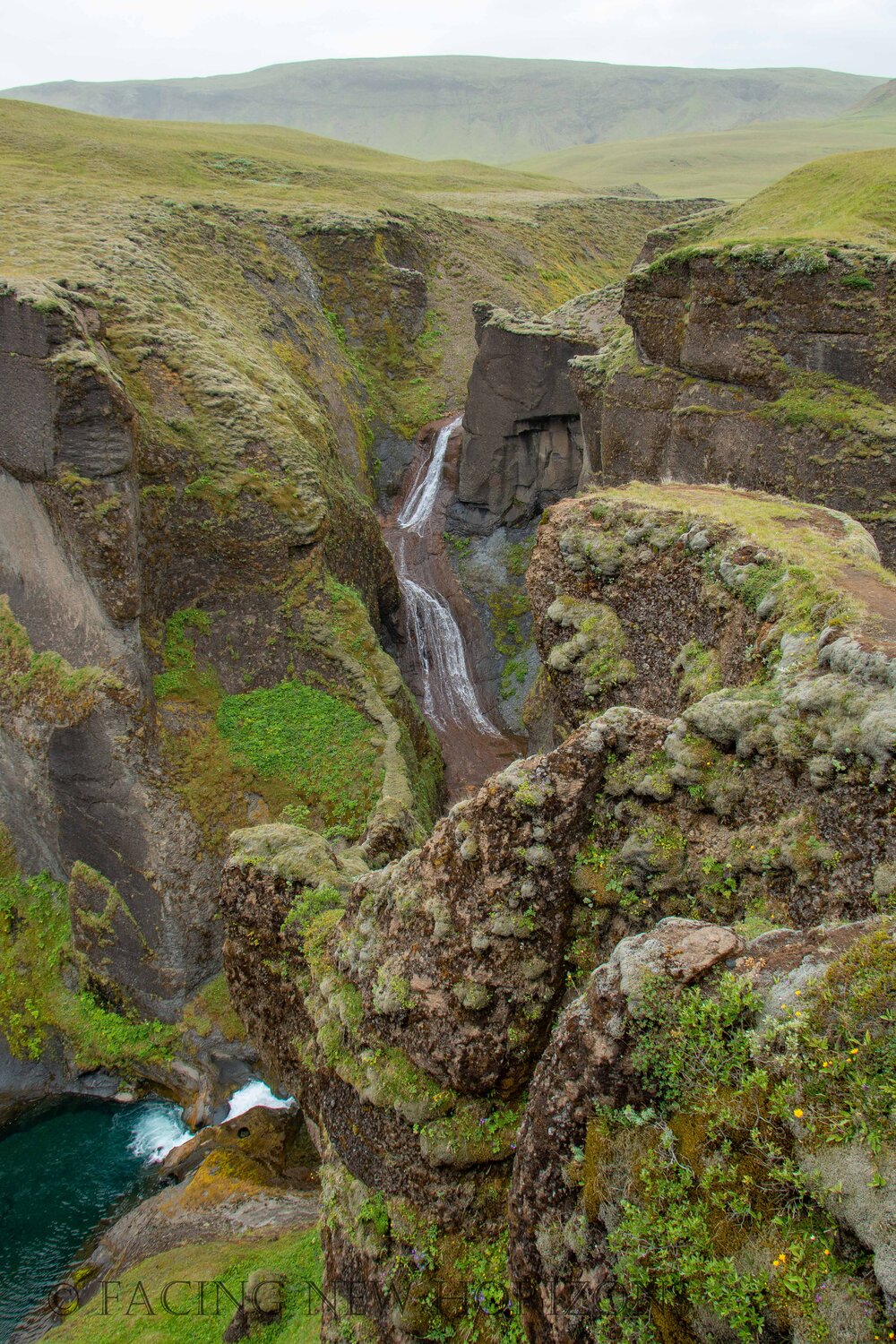  At the end of the canyon, a waterfall feeds the river 