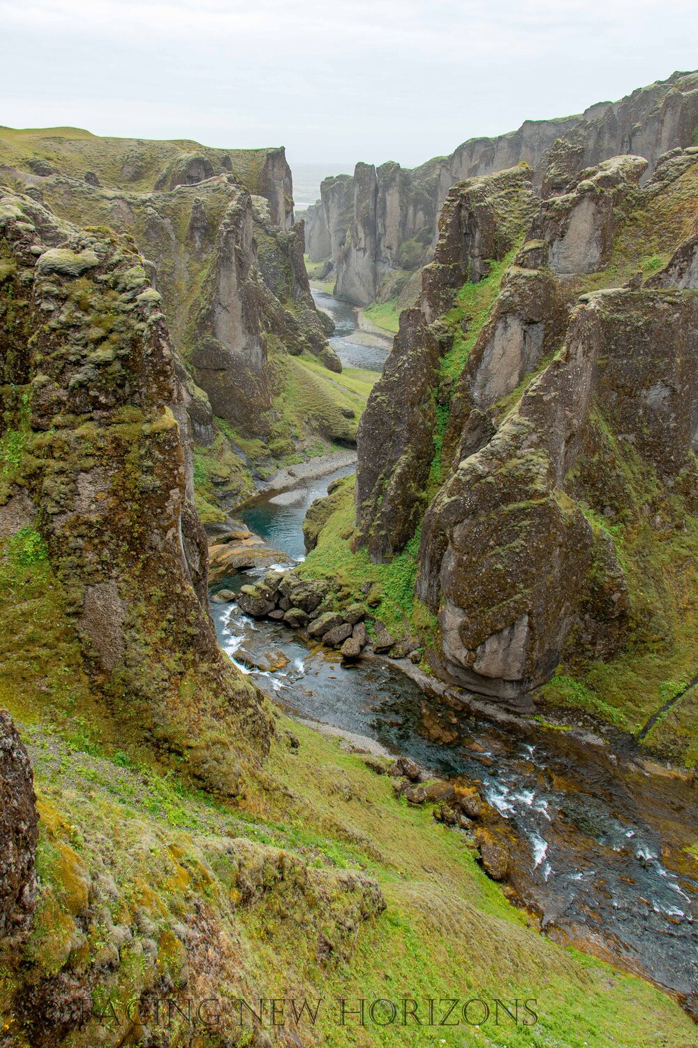  Water flowing from the falls down Fjaðrárgljúfur Canyon 