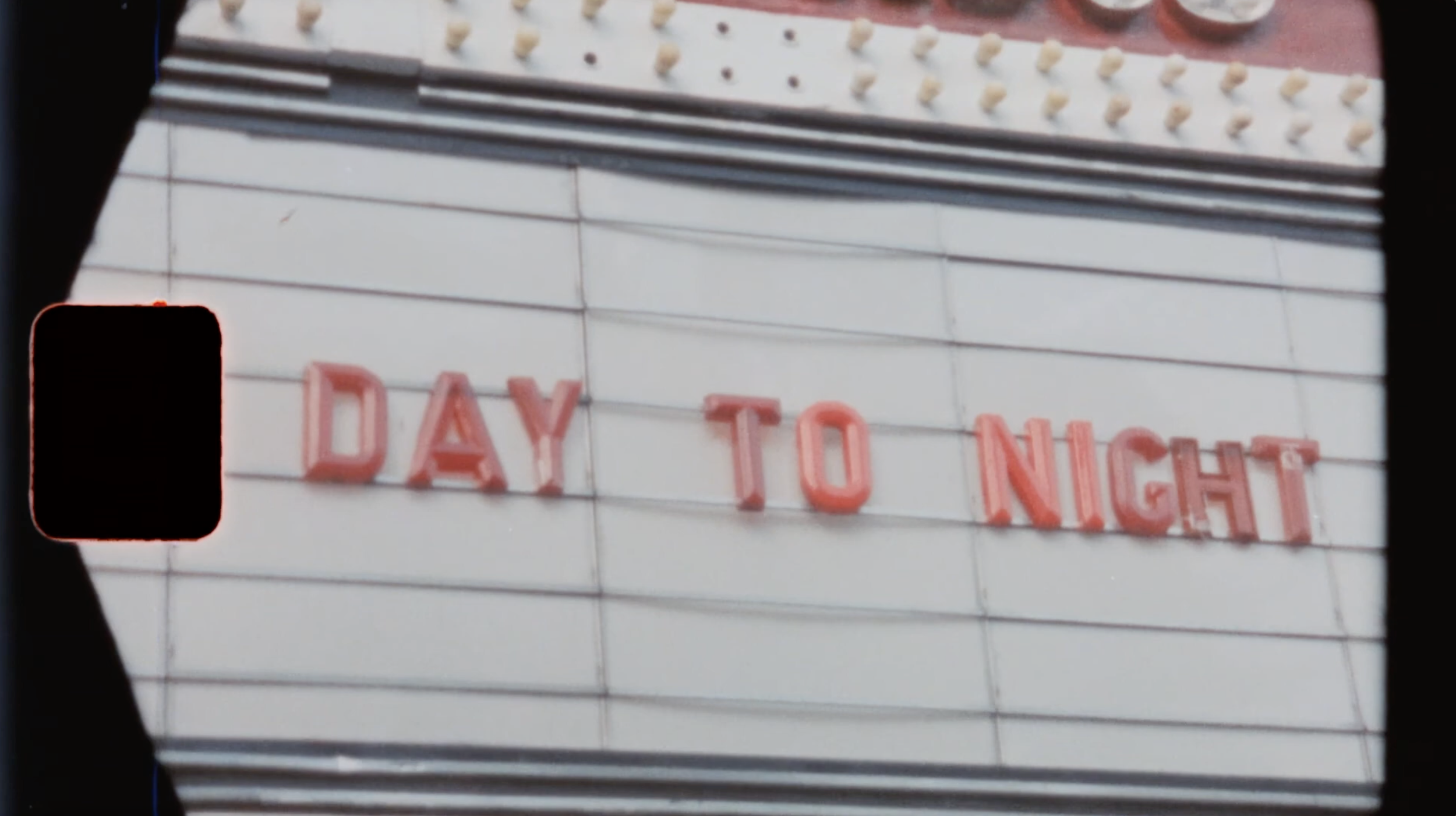 Super 8 - Day to Night sign.png