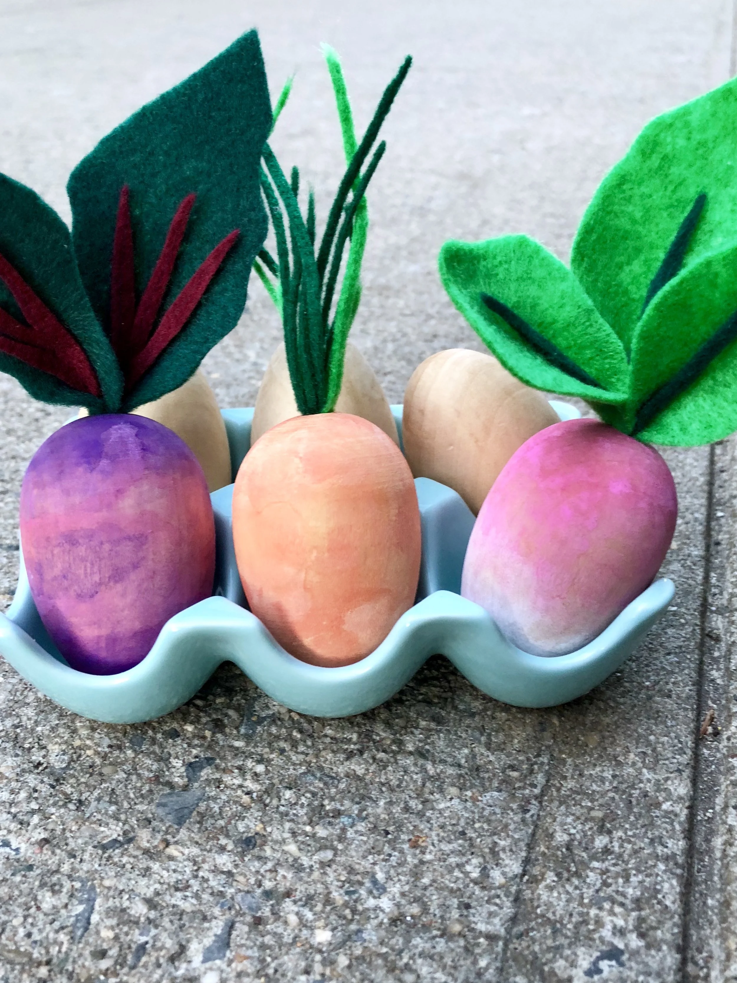 DIY Wooden Watercolor Root Vegetable Easter Eggs #eastereggs #nomesseastereggs #watercolor #easter #easterdiy #easterdecor #easterdecorations #woodeneastereggs #woodcraft #craftsforkids #easycrafts #springcrafts #vegan #rootvegetables #vegetables #eatyourveggies #veggies