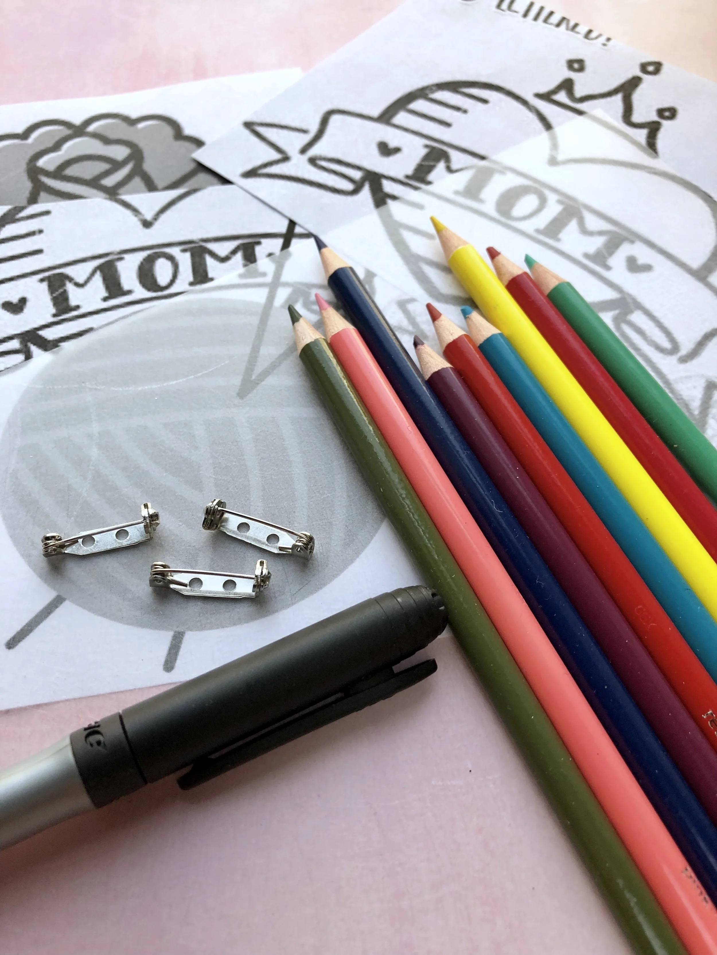 Mother's Day Shrinky Dink Mom Tattoo Pins #mothersdaydiy #mothersdaygifts #shirnkydinks #shrinkydink #shrinkydinkideas #diypin #diybrooch #momtatto #momsday #handmadegifts #giftsformom #giftsforher #badassmom #craftymom #badasswomen #womansrights #futureisfemale