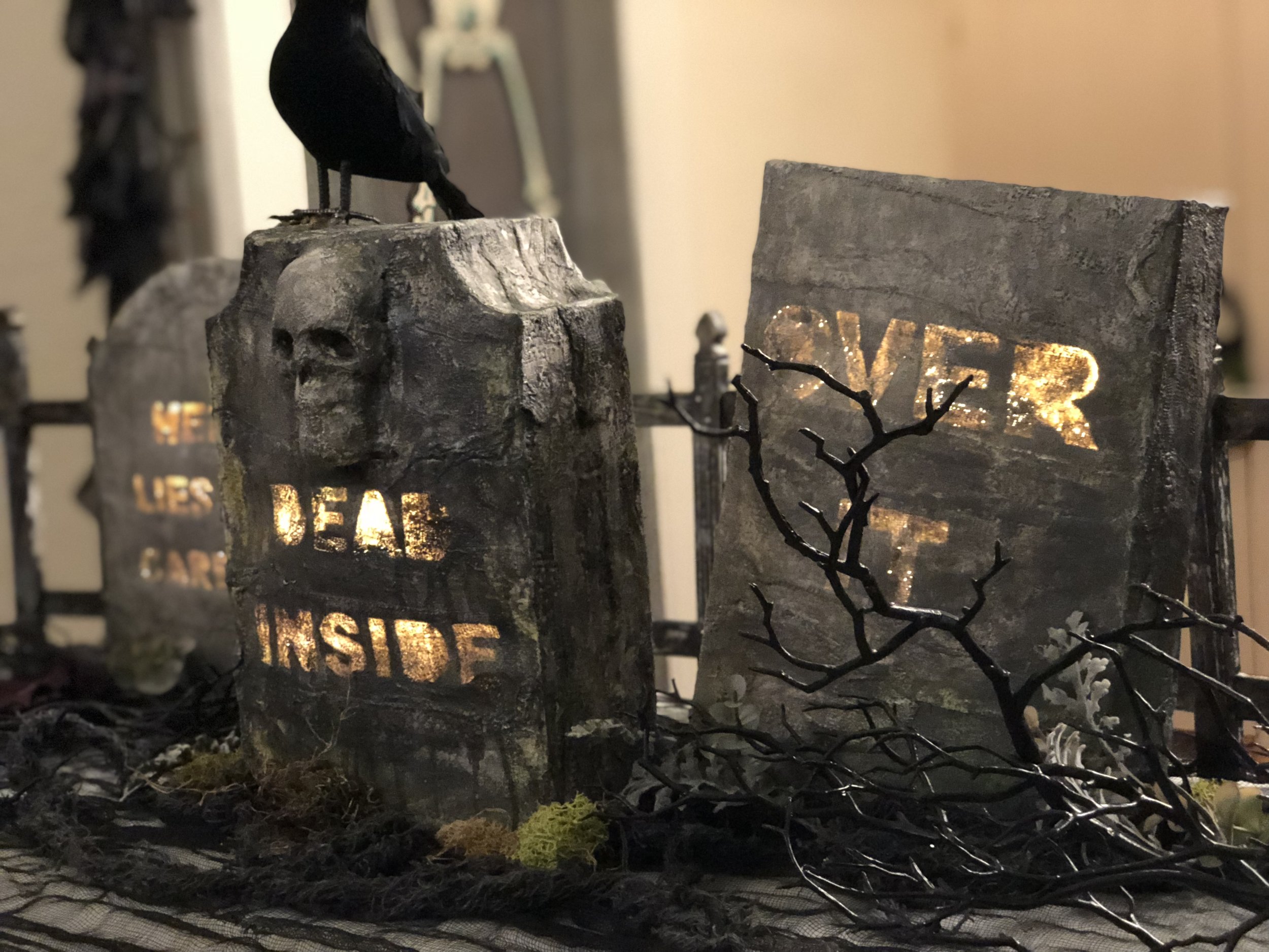 DIY sarcastic hidden message tombstones made out of cereal boxes, plaster bandage strips and paint.