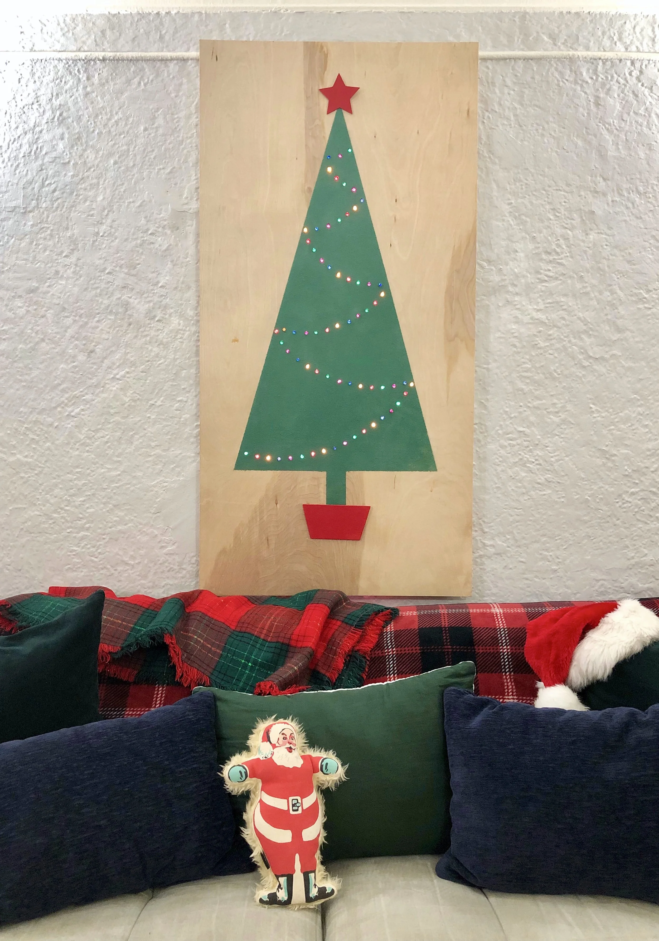 Retro inspired flocked Christmas tree on a piece of plywood. Great for decorating small spaces