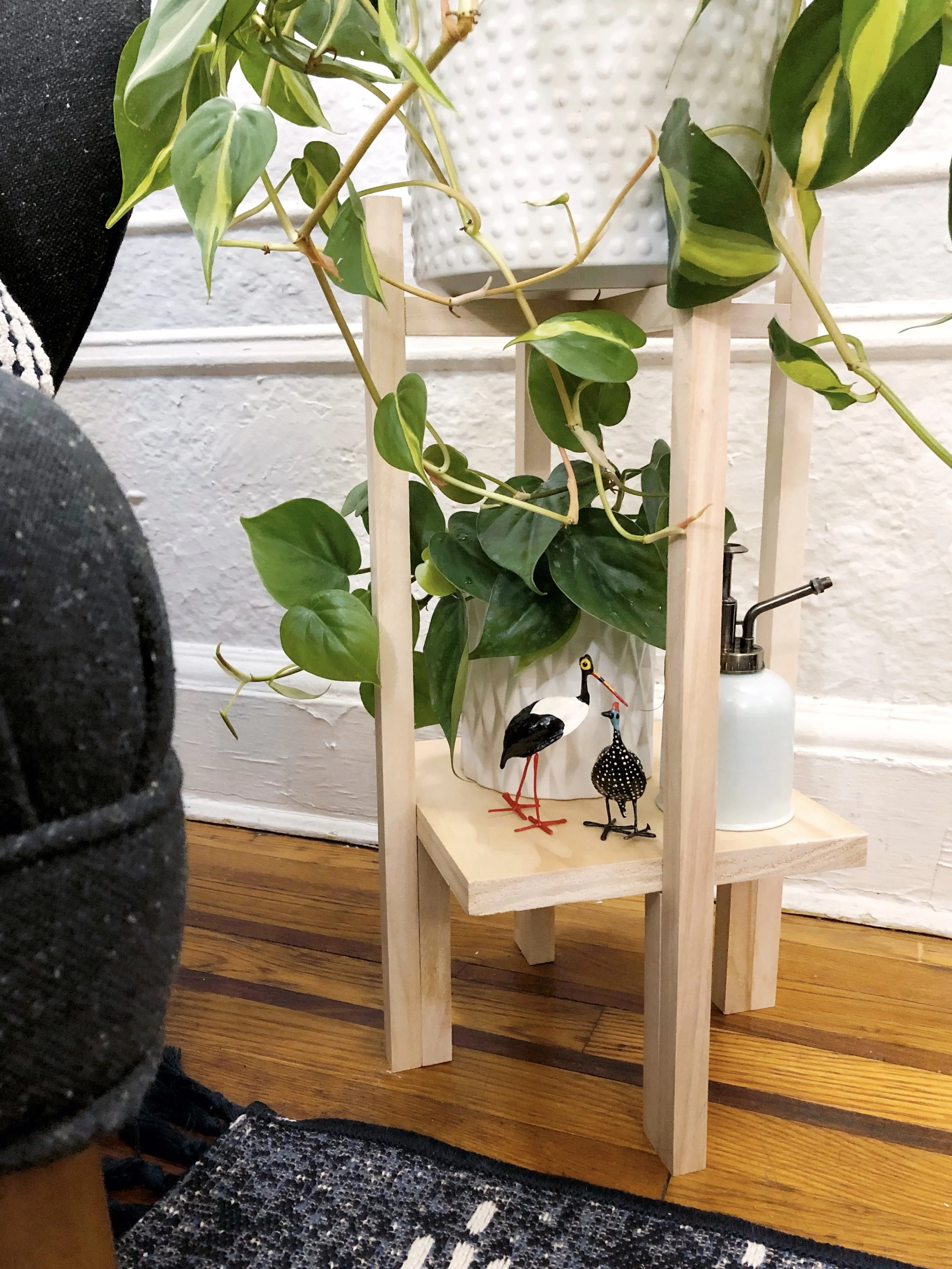 Easy DIY Mid-Century Plant Stand #wood #woodprojects #midcentury #plantstand #houseplants #plants #greenthumb #urbanliving #apartmentliving #easy #easydiy #scrapwood #krazyglue #crazyglue #fastdryingglue #woodglue #squaredowels #gotwood #homedecor #diyhomedecor #indooorgarden #plantdads #woodcraft #miterbox #saw #quickcraft #craftylumberjacks #midcenturymodern #midcenturyhomedecor