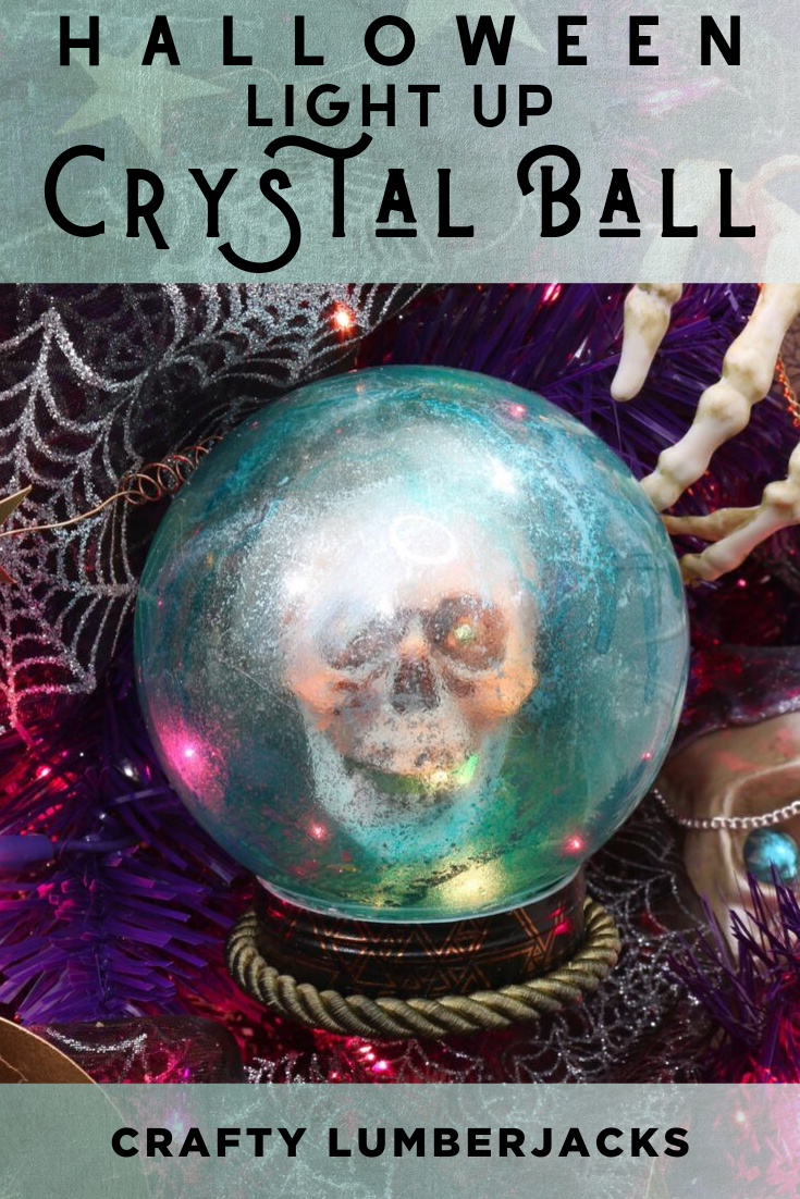 DIY Alcohol Ink Crystal Ball Ornaments - Create a mystical light up crystal ball with a glowing skull inside. #HalloweenTree #treetopia #HalloweenOrnaments #FortuneTellerDecor #VintagePsychicDecoration #TarotCards #psychic #psychicmedium #fortuneteller #palmreader #Paranormal #crystalball #skull #Halloweencraft #lightupskull #howtoalcoholink #halloweendecorations #halloweendecor