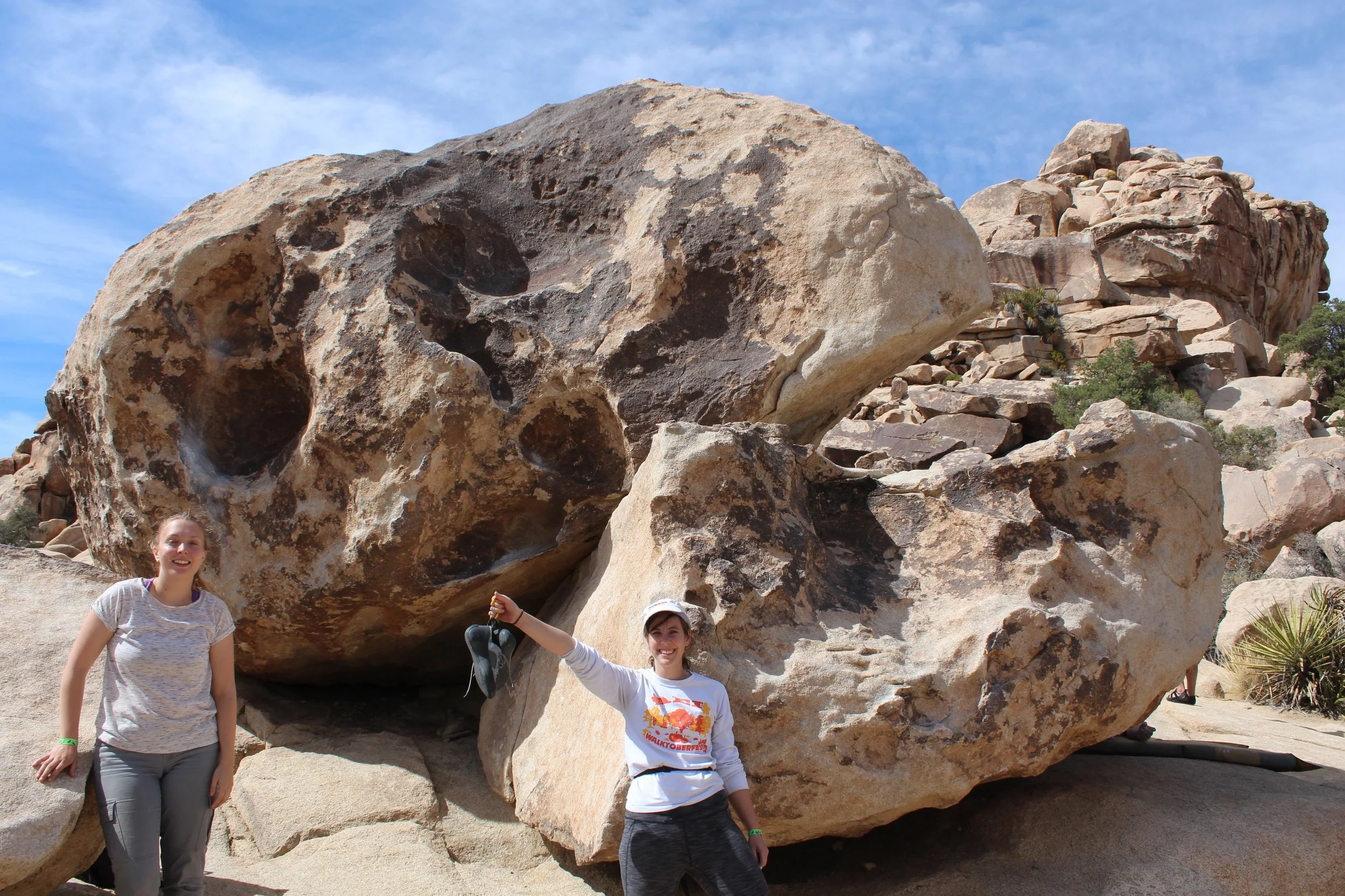 Stefanie and Kristin posing at the Dino's Egg Boulder