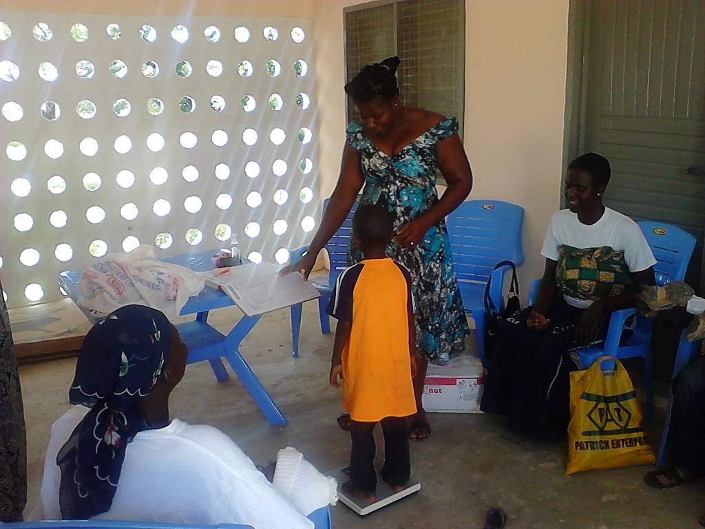 A child being weighed at the nutrition center