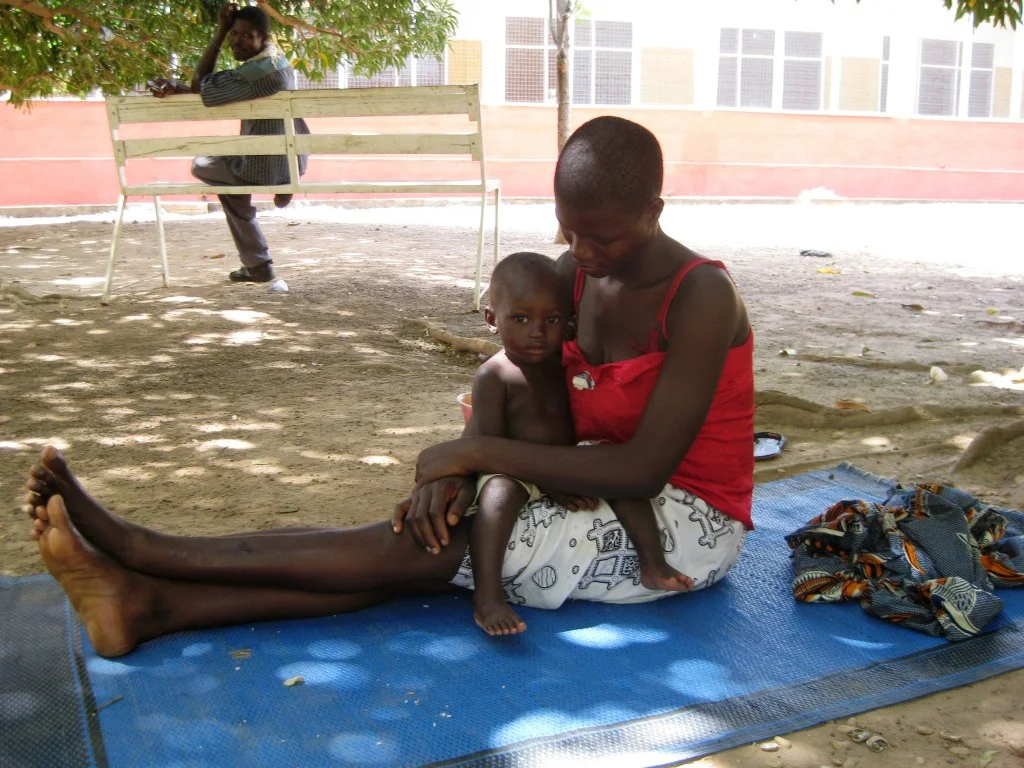 Mother Holding Child Patient in Lawra, Ghana